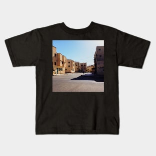 Man Riding Bicycle Through Moroccan Suburb Kids T-Shirt